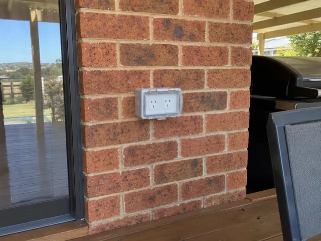 Double outdoor power point on a brick wall beside a patio door in Swansea Heads